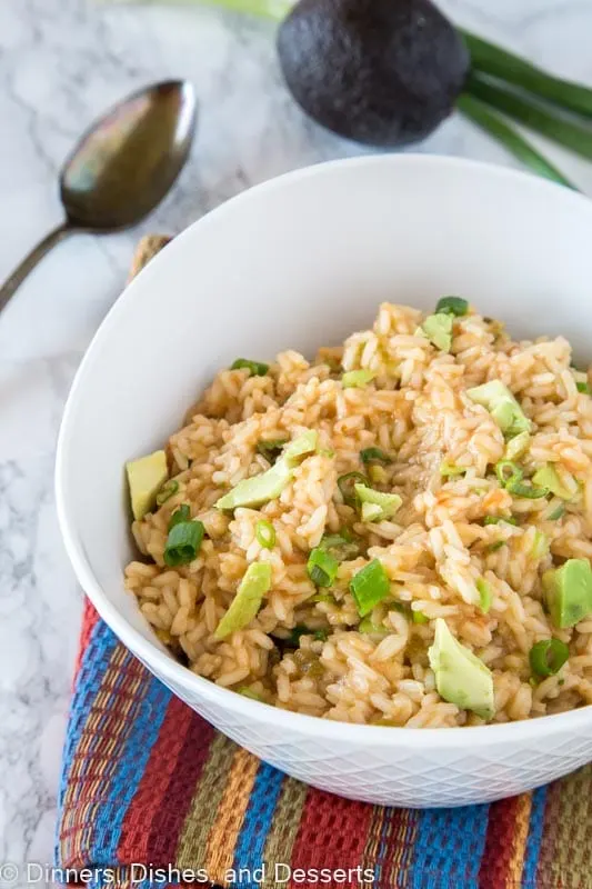 A bowl of rice on a plate, with Dinner and Avocado
