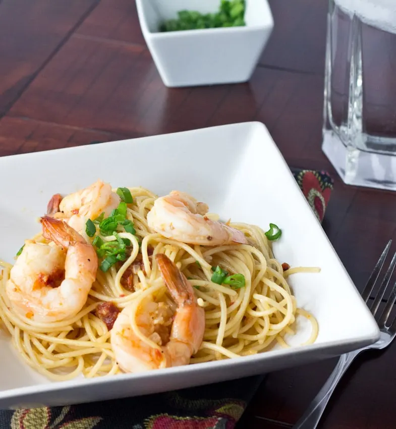 Speedy Shrimp Pasta - Plump and juicy shrimp sauteed in olive oil, garlic, and onions. Tossed with pasta for a quick and easy dinner.
