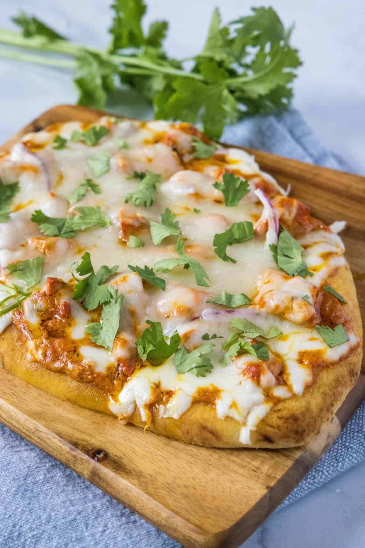 Chicken Tikka Pizza chicken tikka pizza on cutting board