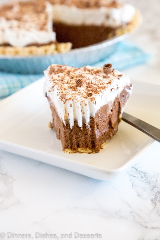 French Silk Pie - a rich and creamy chocolate pie with a layer of silky chocolate mousse topped with fresh whipped cream and chocolate shavings!  