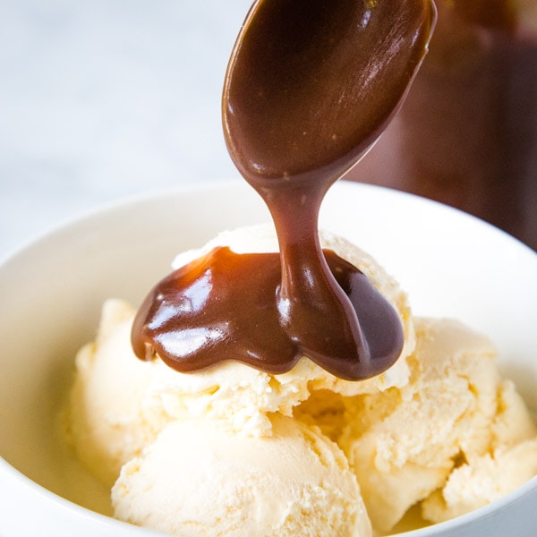 Hot Fudge Sauce - Smooth, velvety and rich chocolate sauce that is the perfect topping for ice cream sundaes! Just a few ingredients and under 15 minutes to make, so much better than store bought!  
