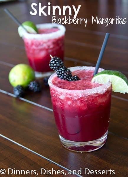 A cup of margarita on a table, with Margarita and Blackberry