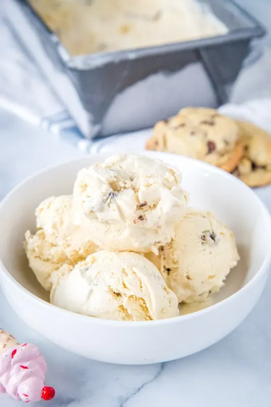 white bowl filled with scoops of cookie dough ice cream
