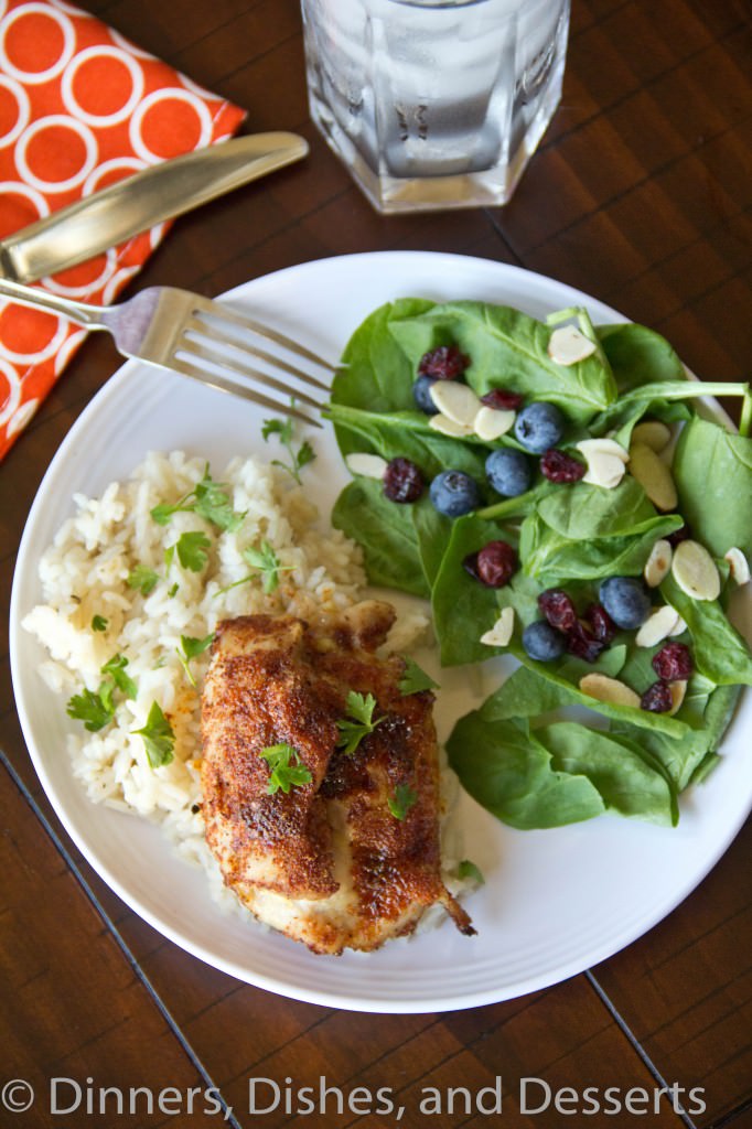 spiced chicken thighs with garlicky rice on a plate