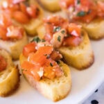 Close up of a plate full of bruschetta