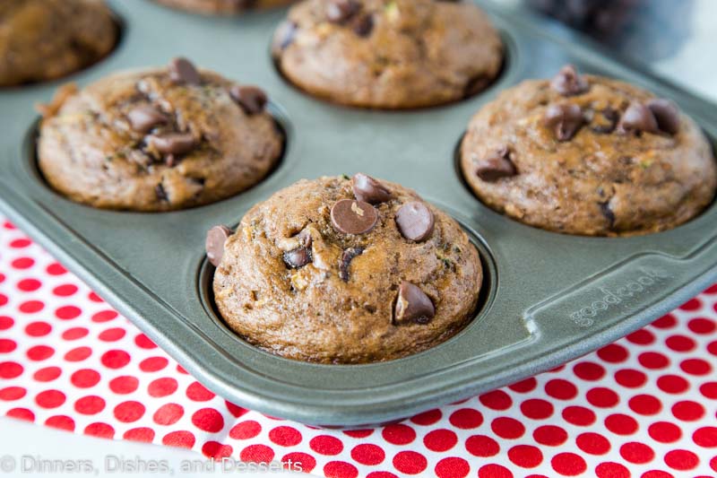Chocolate Zucchini Muffins -Â Moist and tender chocolate muffins filled with zucchini and chocolate chips. Great way to get more veggies into your family without them knowing!