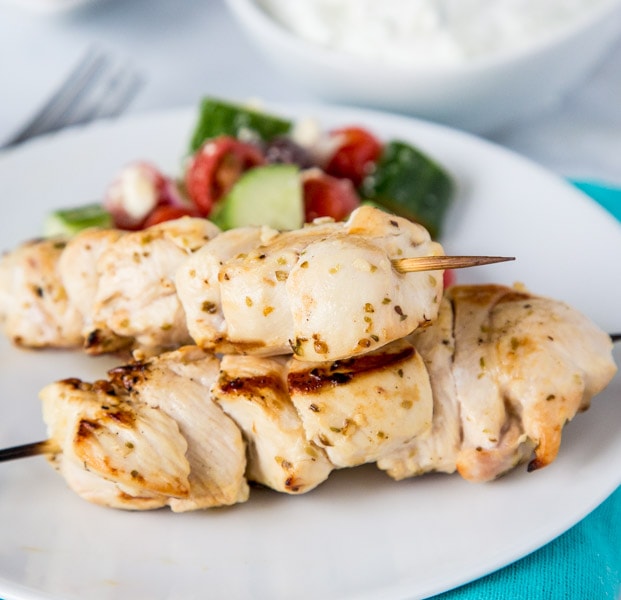 Chicken Souvlaki Skewers with Tzatziki Sauce - tender pieces of Greek chicken that are marinated and grilled to perfection.  Served with Tzatziki dipping sauce for a great weeknight dinner. 