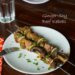 ginger soy beef kabobs on a plate