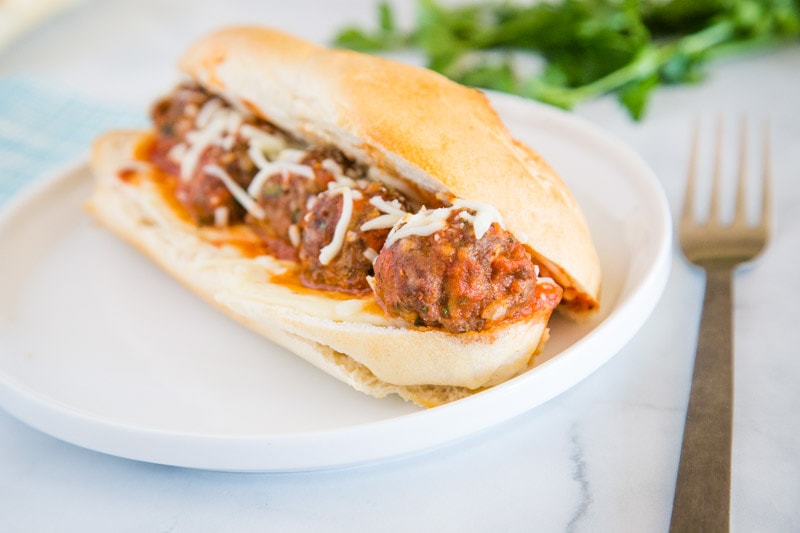 A close up of food on a plate, with Meatball Sub