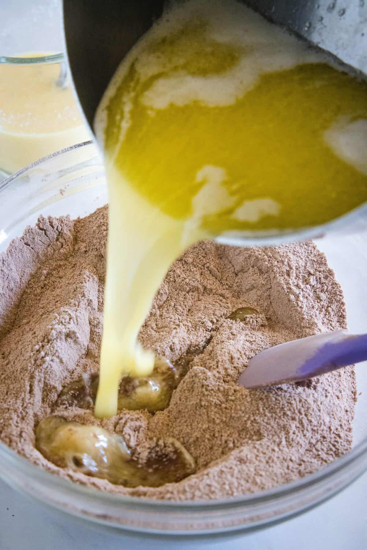 adding melted butter to dry ingredients