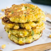 A stack of four zucchini and corn fritters