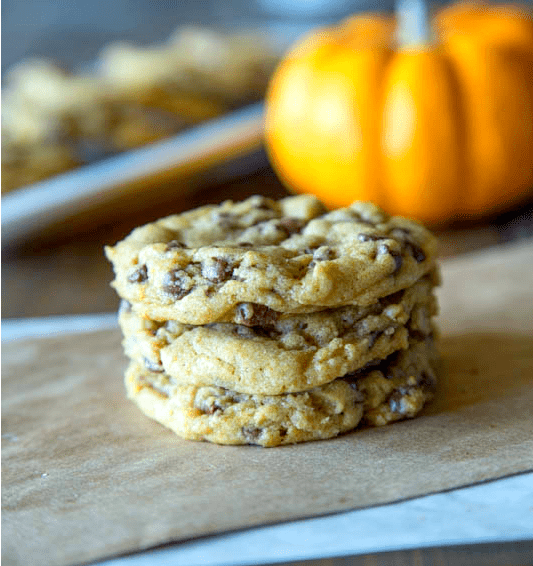 chewy pumpkin chocolate chip cookies on a board