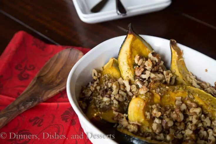 acorn squash with rosemary and walnuts in a bowl