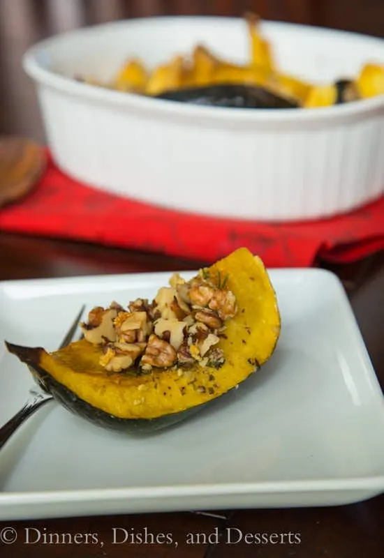 acorn squash with rosemary and walnuts in a bowl