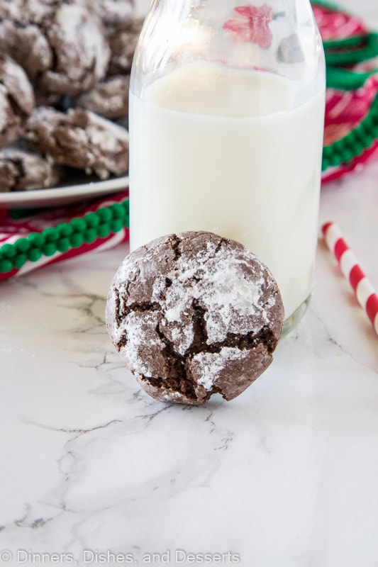 Chocolate cookie next to a glass of millk