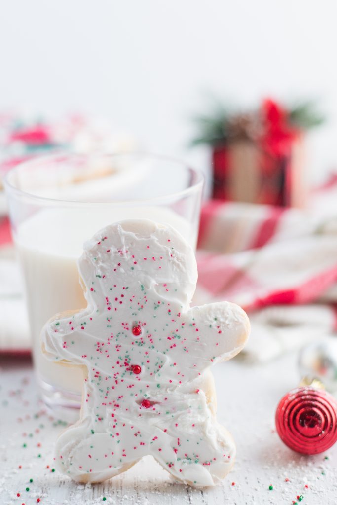 frosted sugar cookie and a glass of milk