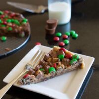 gluten free peanut butter cup cookie pizza on a plate