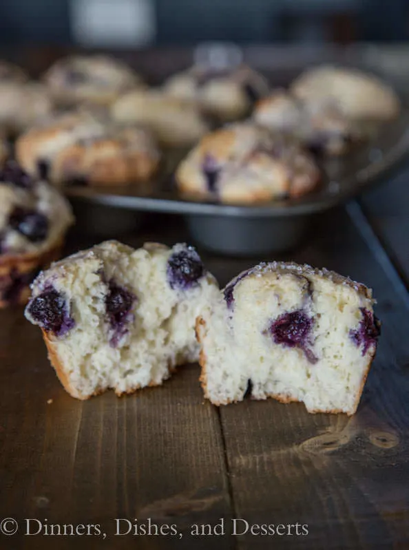 bakery style blueberry muffins on a board