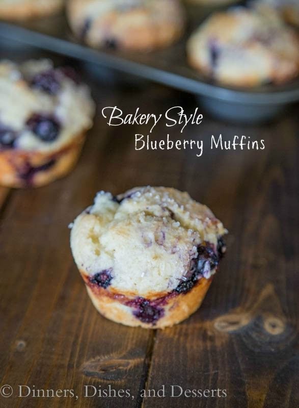 bakery style blueberry muffins on a board