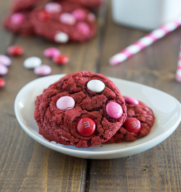 Red Velvet M&M Cookies - thick and chew cake mix cookies with just a couple ingredients. Use with any cake mix, and add whatever mix-ins you like!