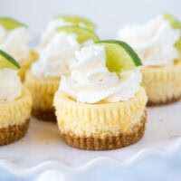 A close up of cheesecake on a plate, with Cheesecake and Lime