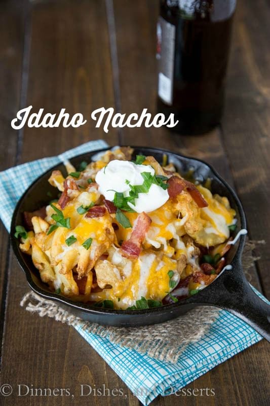 Copycat Granite City Idaho Nachos - a restaurant favorite appetizer at home!  Crispy waffle fries topped with bacon, green onions and lots of melty cheese!