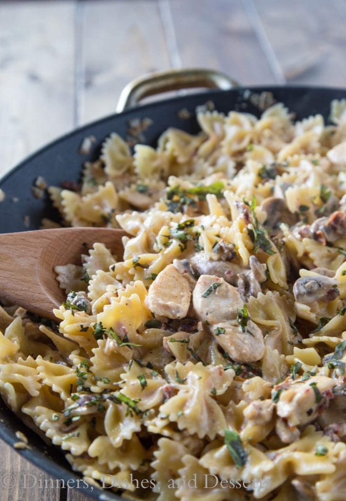 Pasta Milano - A homemade version of Macaroni Grill's Pasta Milano. A creamy garlic and sundried tomato sauce, with chicken and mushrooms, over bowtie pasta