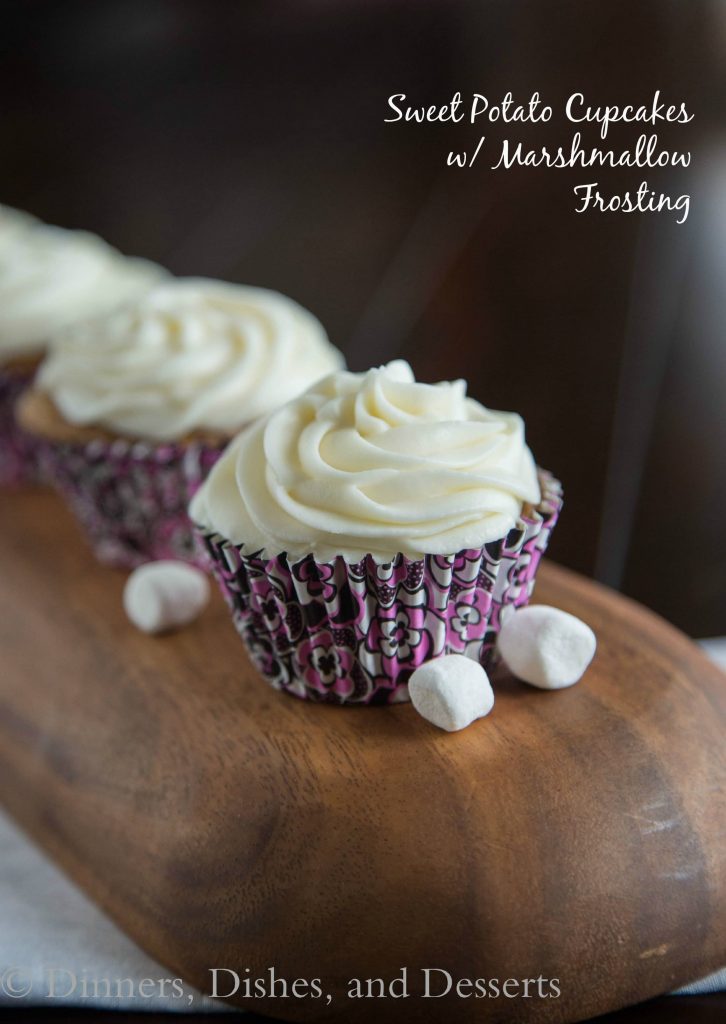 Sweet Potato Cupcakes - Turn one of your favorite side dishes into dessert! Moist spiced sweet potato cupcakes topped with a marshmallow frosting are a great dessert for fall!