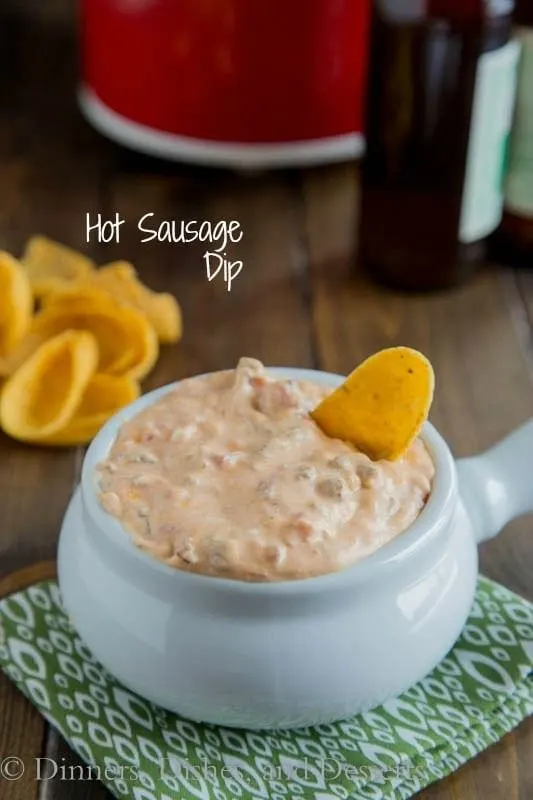 Hot Sausage Dip - a creamy, cheesy, hot sausage dip that is perfect for any get together. Make ahead and heat in the crock pot for the big game!