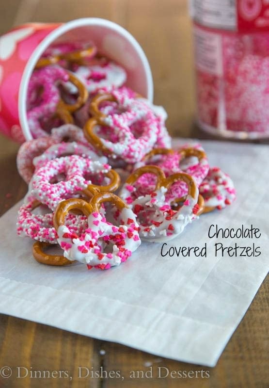 Chocolate Covered Pretzels - super easy and fun treat for any occasion. Pretzels dipping in white chocolate and coated in sprinkles.