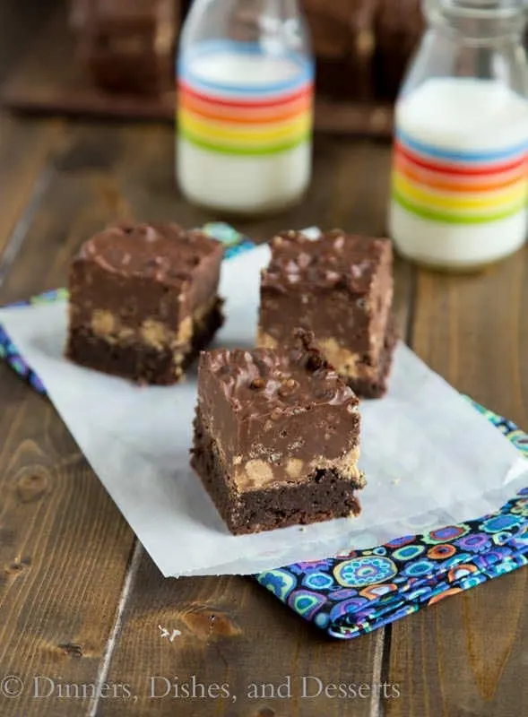Peanut Butter Crunch Brownies - some of the most decadent brownies every! Fudgy brownies with a layer of peanut butter cups and a layer of crunch peanut butter and chocolate fudge!