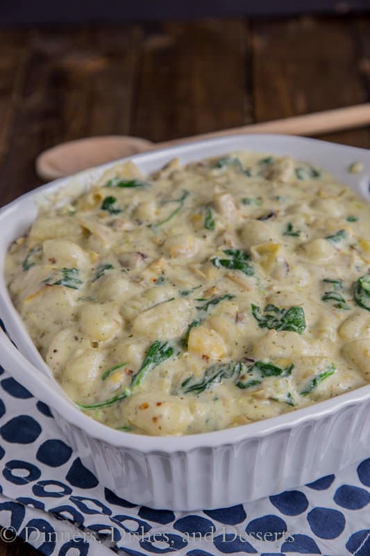 Creamy Spinach & Artichoke Gnocchi - our favorite dip turned into a creamy and delicious pasta dinner.  You can make it ahead, and freeze for later!