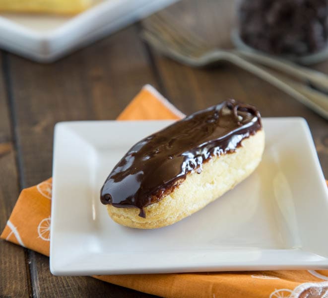 A chocolate eclair on a plate