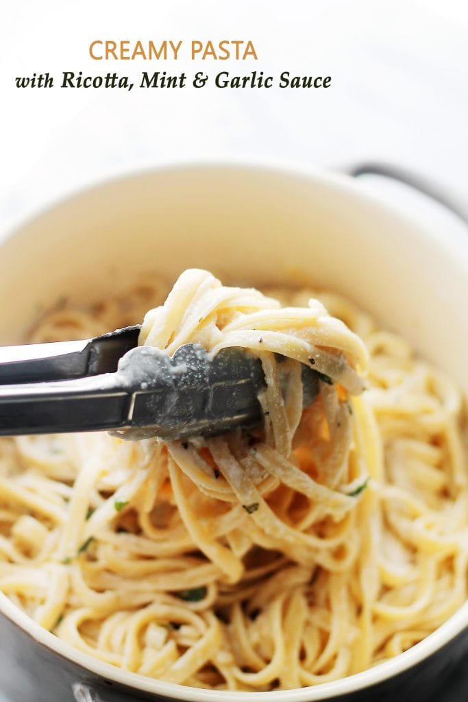 creamy pasta with ricotta mint and garlic sauce in a bowl