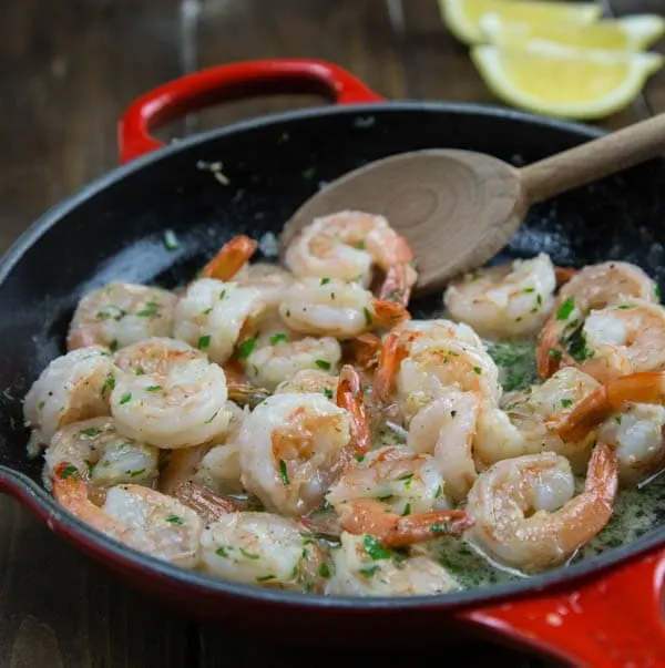 Lemon Garlic Shrimp - Super quick and easy dinner of shrimp sauteed in butter and garlic and then finished with lemon juice.