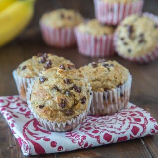 Skinny Banana Chocolate Chip Muffins - a lightened up (but you would never know it) banana muffin with chocolate chips. They freeze well, so you can always have them on hand for quick breakfasts.