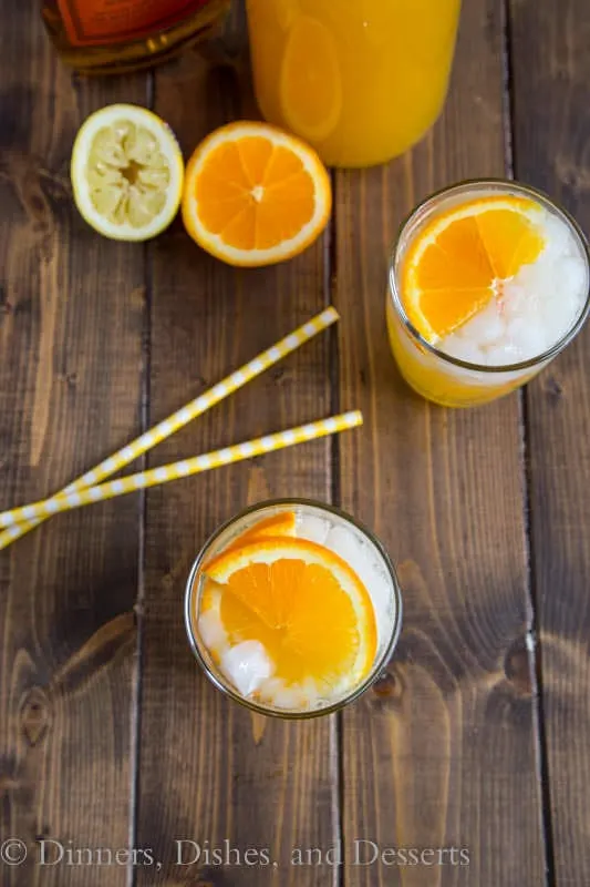 Whisky Sour Punch - orange juice, lemon juice and bourbon some together for a fizzy and fun punch. Great for get togethers, and you can even make it ahead!