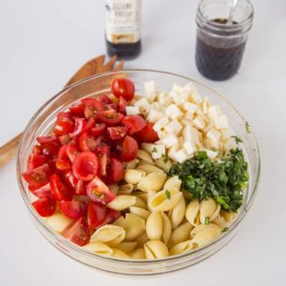 Caprese Pasta Salad - turn classic caprese salad into a quick pasta salad. Great for summer get togethers, quick lunches, or a light dinner!