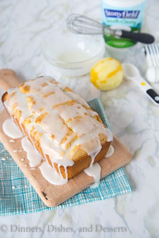 Iced Almond-Lemon Loaf Cake - super moist and tender loaf cake with lots of lemon flavor. Topped with a tangy lemon glaze.