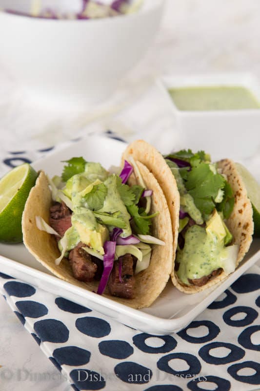 Skirt steak street tacos – tender grilled skirt steak wrapped in a charred corn tortilla and topped with a creamy cilantro lime sauce. Just like Southern California at home in no time!