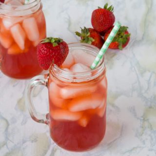 Strawberry Sweet Tea - Southern style sweet tea with a little twist of strawberry. Turn up your ice tea game this summer and make strawberry iced tea.
