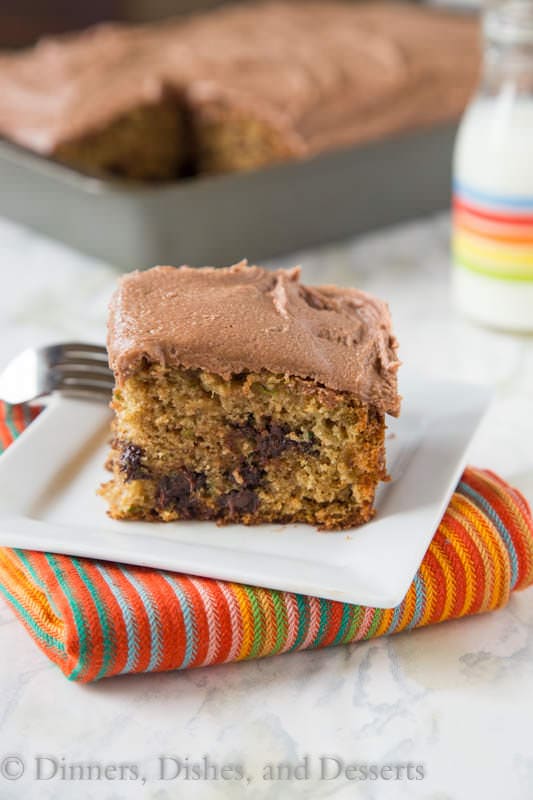 zucchini chocolate chip cake with nutella buttercream frosting on a plate