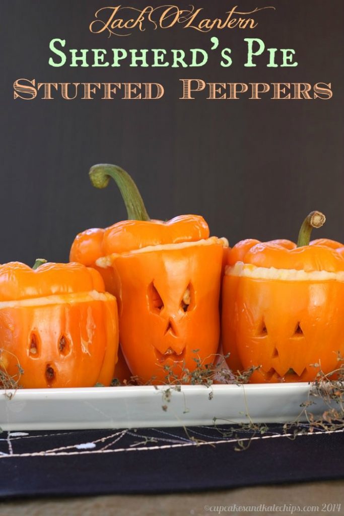 Front view of jack o lantern stuffed peppers.