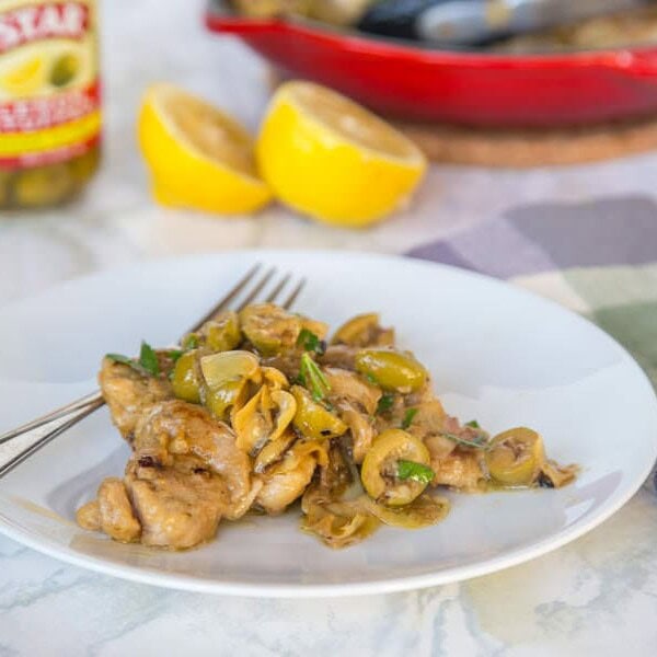 A plate of food on a table, with Chicken and Dinner