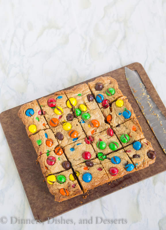 M&M Peanut Butter Bars - thick and chewy peanut butter bars loaded with peanut butter M&M's for even more peanut buttery goodness!