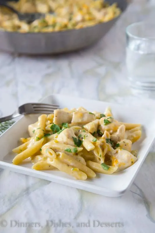 Salsa Verde Chicken Skillet – an easy one pan pasta skillet with salsa verde, chicken, and lots of melty gooey cheese!