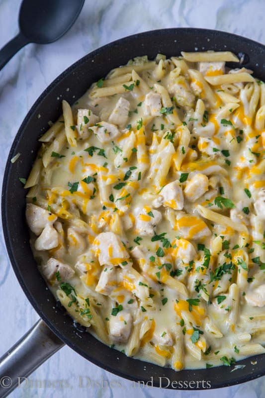 Salsa Verde Chicken Skillet – an easy one pan pasta skillet with salsa verde, chicken, and lots of melty gooey cheese!