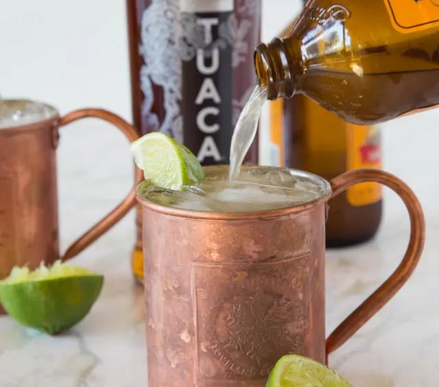 TUACA® Mule - A fun twist on the classic Moscow Mule! A citrusy vanilla liqueur adds tons of great flavor to a classic cocktail.