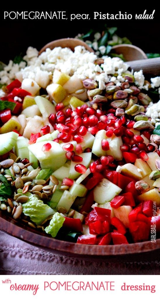 Pomegranate, Pear, Pistachio Salad (with Creamy Pomegrate Dressing) in a wooden bowl