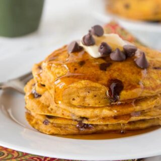 Pumpkin Chocolate Chip Pancakes - super light and fluffy pumpkin pancakes full with lots of chocolate chips and topped with maple syrup.